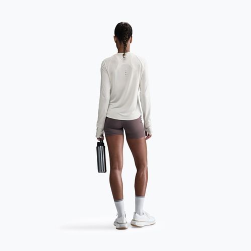 Moteriški bėgimo marškinėliai su ilgomis rankovėmis Nike Swift Dri-FIT UV sail