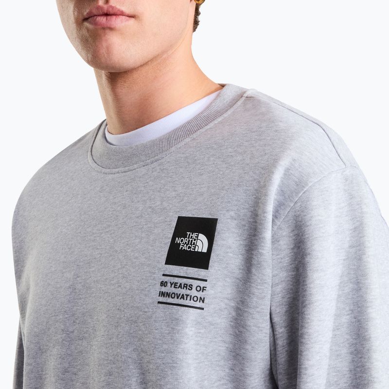Džemperis The North Face Celebration Relaxed Crew Graphic tnf light grey heather 9